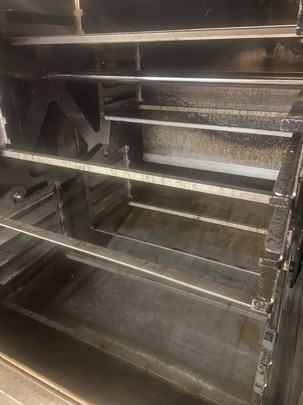 Commercial BBQ smoker interior degreased and clean after Top Shelf OBX service